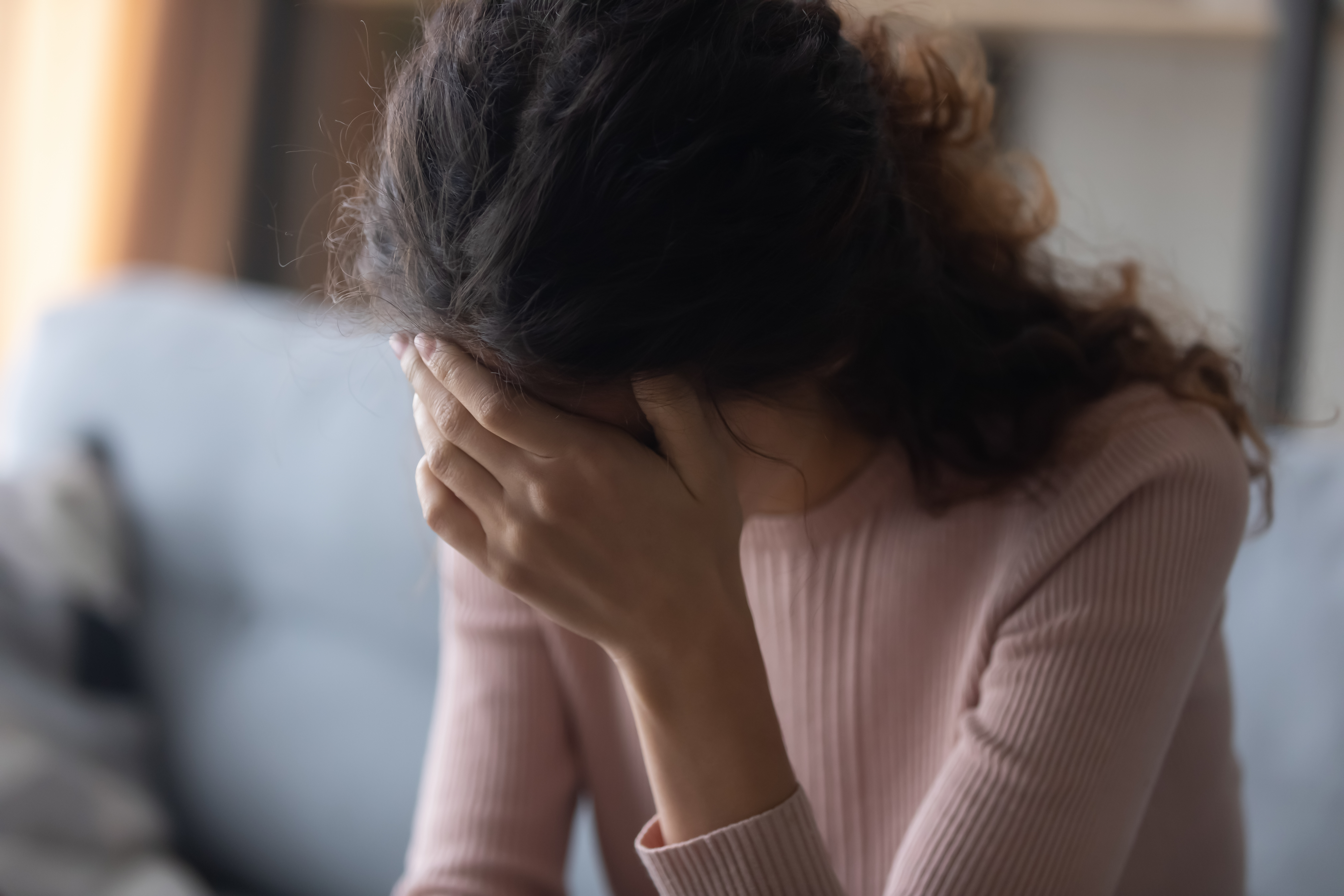 Close,Up,Frustrated,Depressed,Woman,Touching,Forehead,,Feeling,Headache,,Sitting