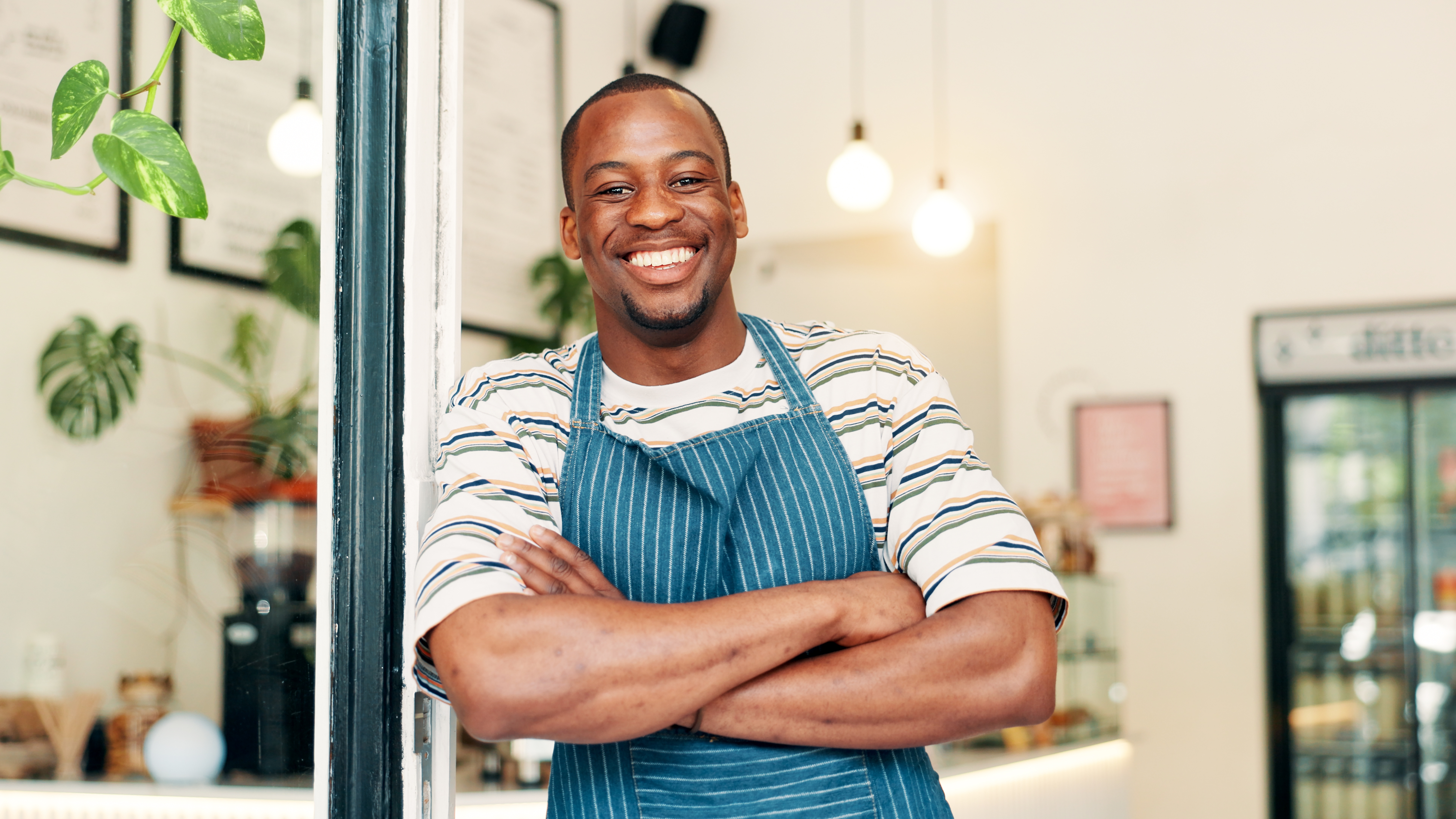 Portrait,,Smile,And,Black,Man,In,Coffee,Shop,,Arms,Crossed